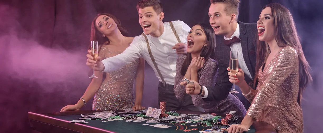 Casino Nights Bachelor Party Idea Casino Nights jaco costa rica friends cheering at a craps table and a group photo